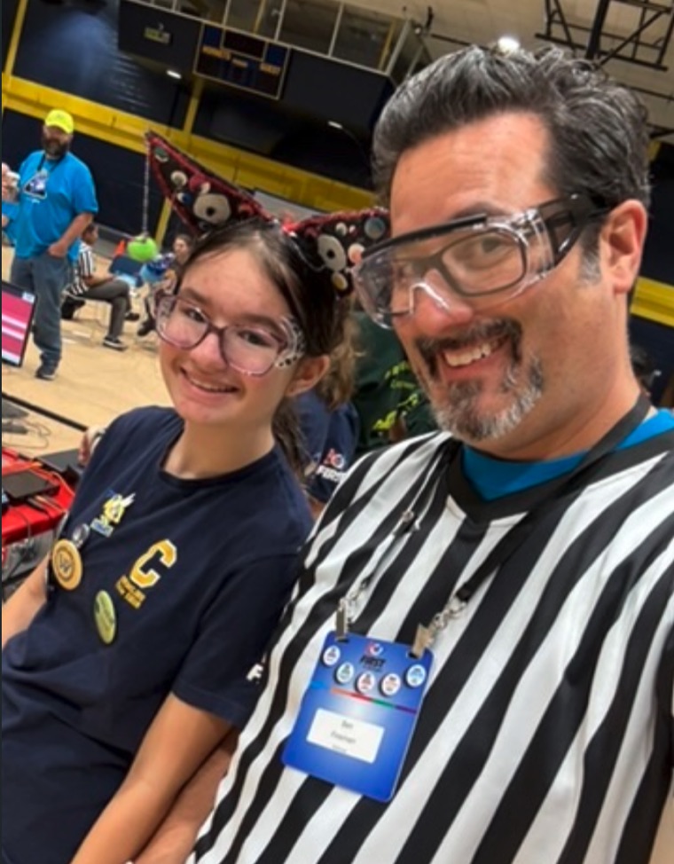 Ben Fineman refereeing a youth robotics competition
